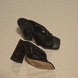 Delta Black Mules Sleek and Versatile